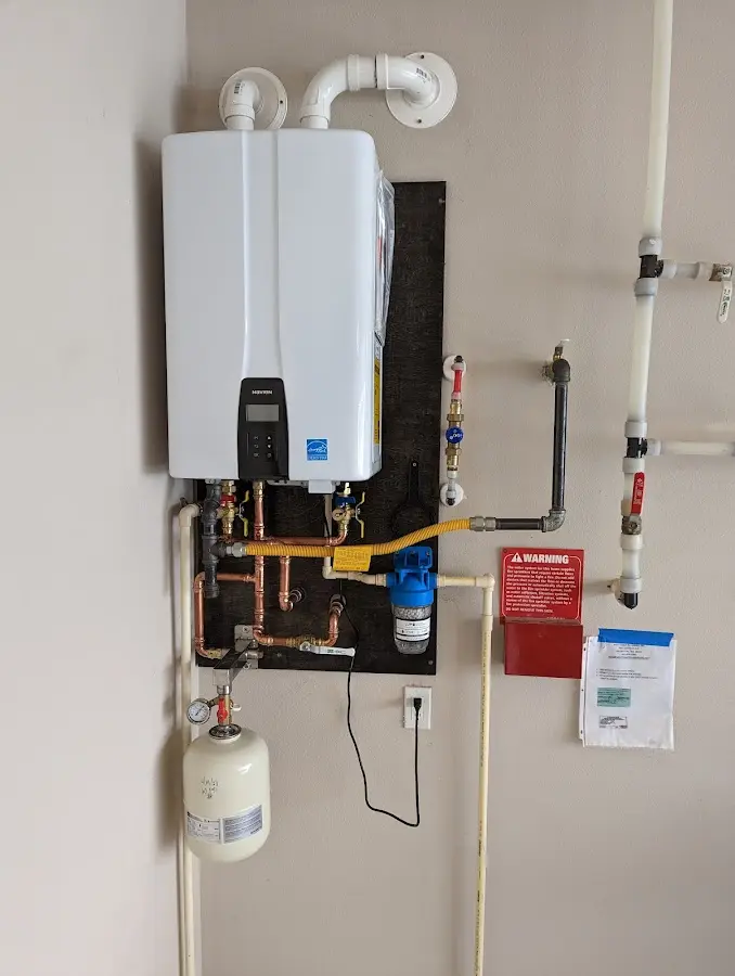 Professional plumber installing copper piping in a North Fort Myers home